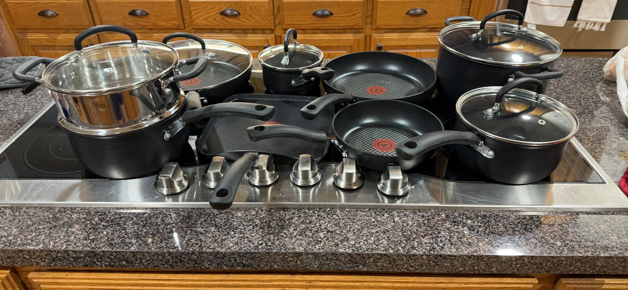 T-fal Ultimate Hard Anodized Nonstick Pots and Pans Set, 14-Piece, Onyx | Titanium nonstick coating, Thermo-Spot heat indicator, Oven safe to 400F, Dishwasher safe, All stovetops except induction customer photo 1