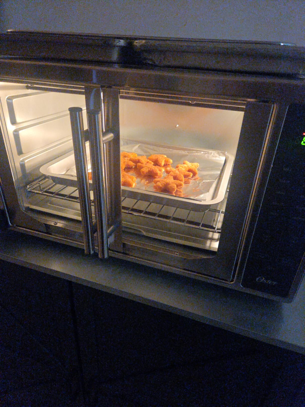 Oster Extra Large 42L French Door Countertop Toaster Oven, 10-in-1 Air Fryer Oven, Stainless Steel customer photo 1