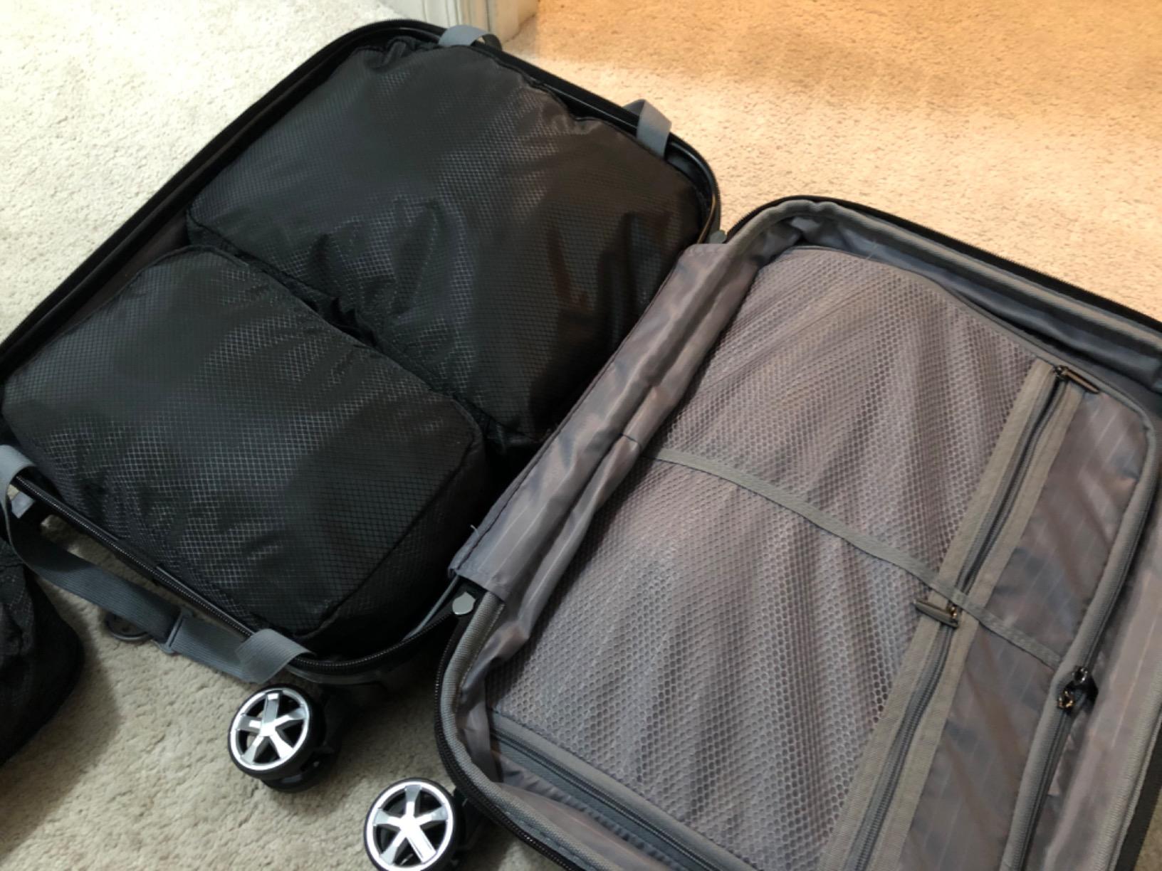 Amazon Basics 30-Inch Hardside Checked Spinner Luggage With TSA Lock, Lightweight Expandable Suitcase, Scratch-Resistant Surface, 8 Multi-directional Wheels, Black customer photo 1