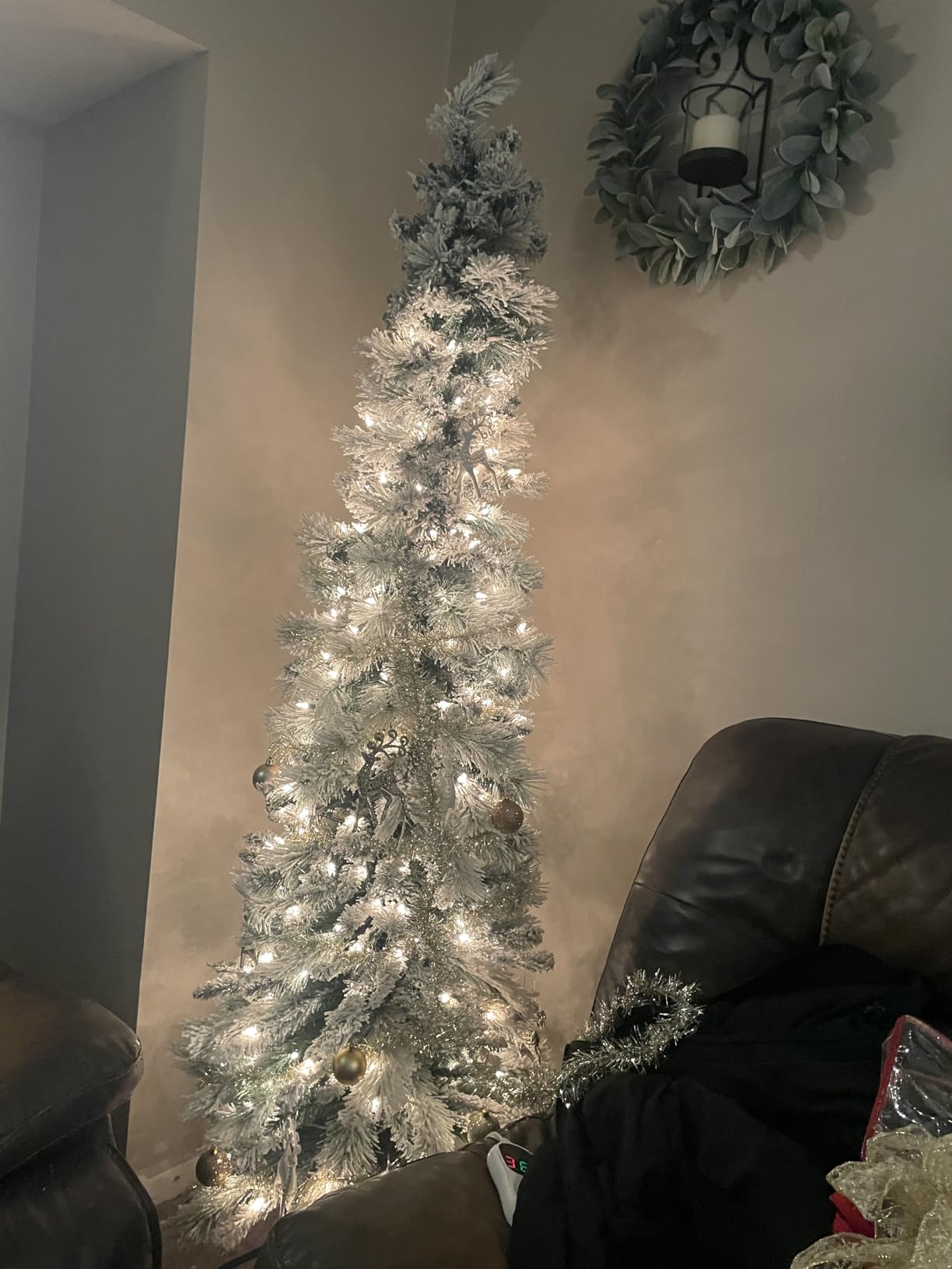 Puleo International 6.5ft Pre-Lit Flocked Portland Pine Pencil Christmas Tree with 300 Clear Lights, 410 Realistic Dense Snow Flocked Branch Tips, Easy Setup Artificial Trees with Sturdy Metal Stand customer photo 2